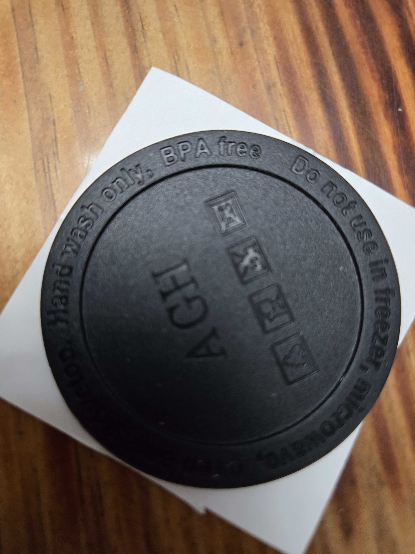 BPA-free tumbler lid with hand wash instructions and recycling symbols, designed for seamless beverage use.