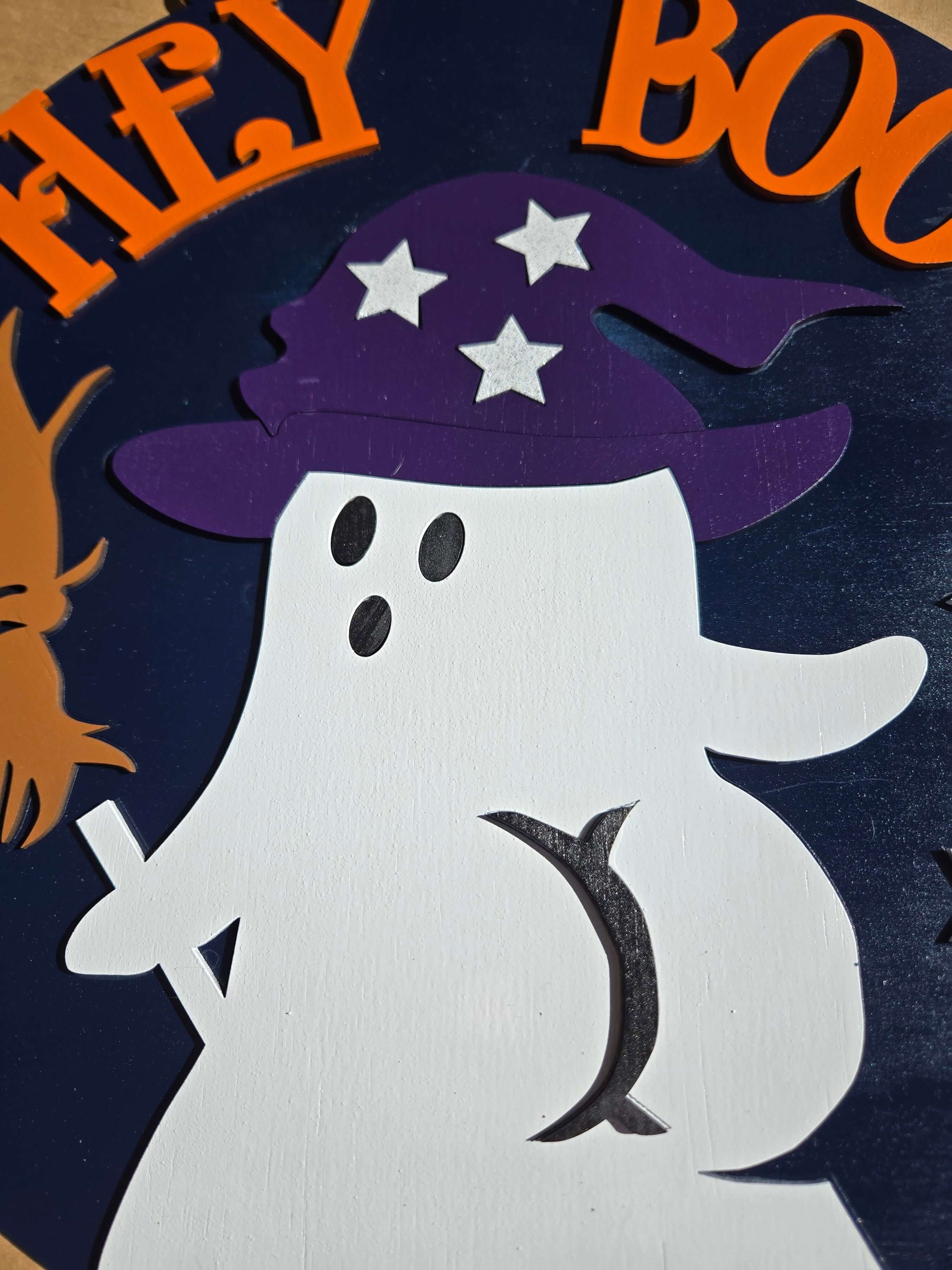 Hey boo ghost wooden sign with purple witch hat and stars, perfect for Halloween decor.