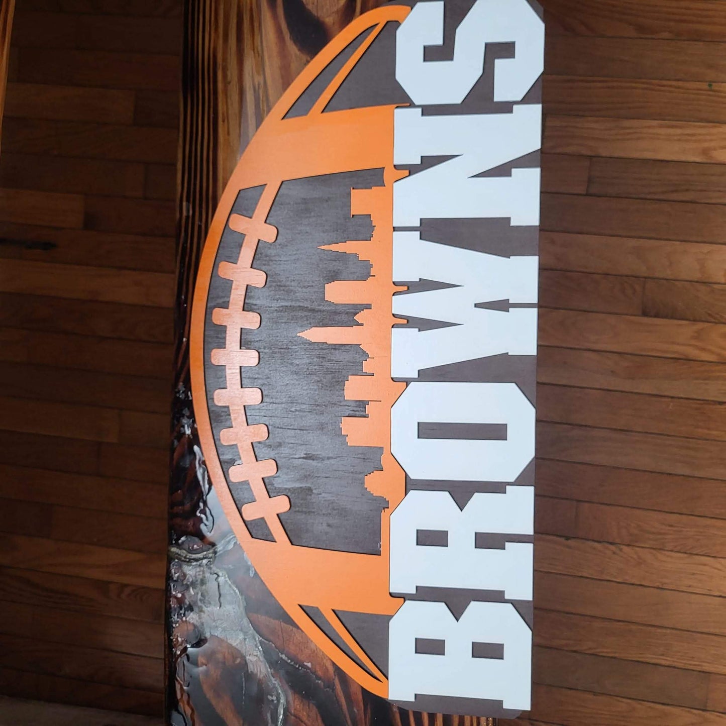 Cleveland Browns football wooden decor sign featuring a layered design with football and skyline details.