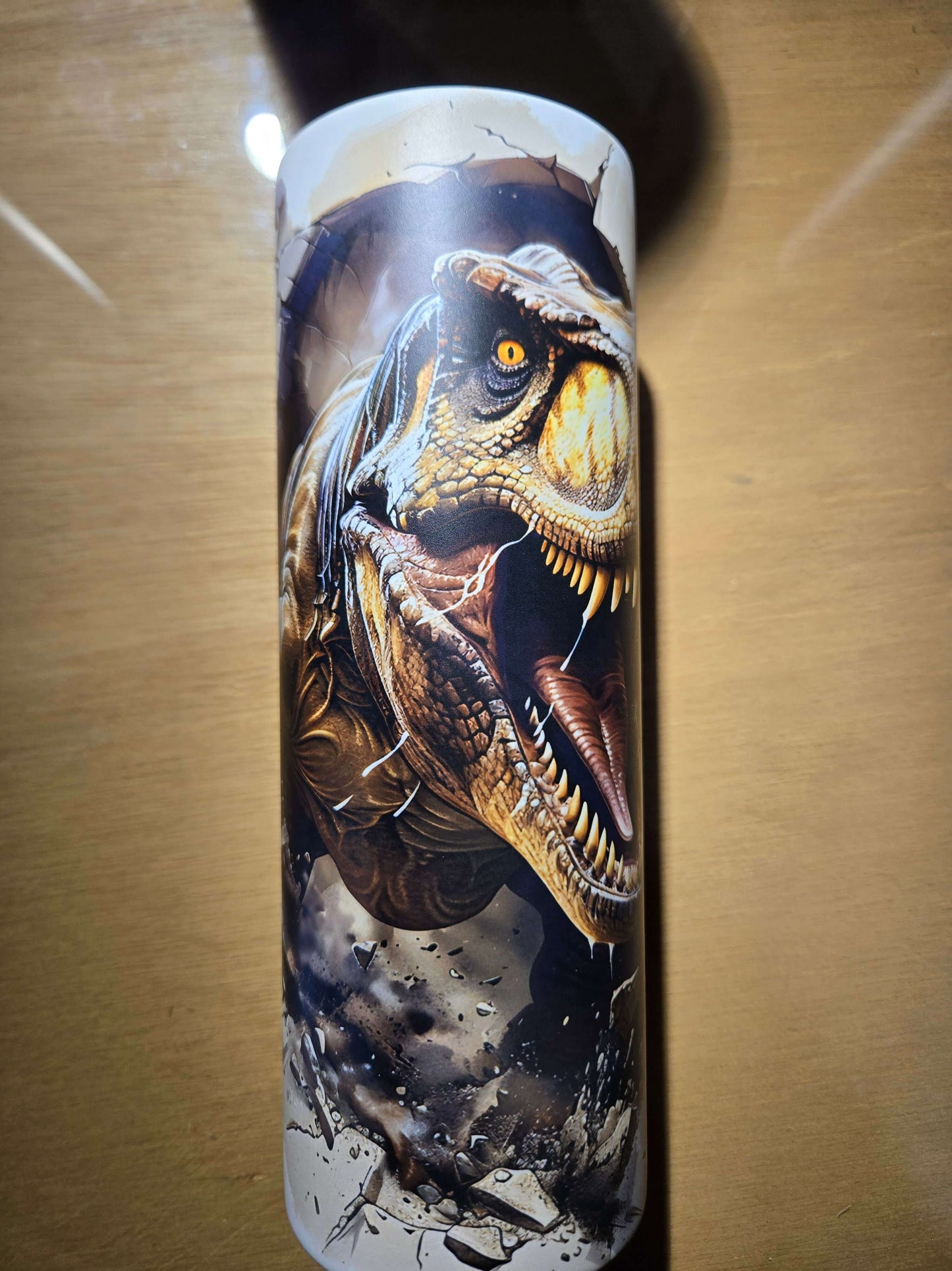 T-Rex glow in the dark tumbler cup featuring a fierce dinosaur design, perfect for drinkware collectors and dinosaur lovers.