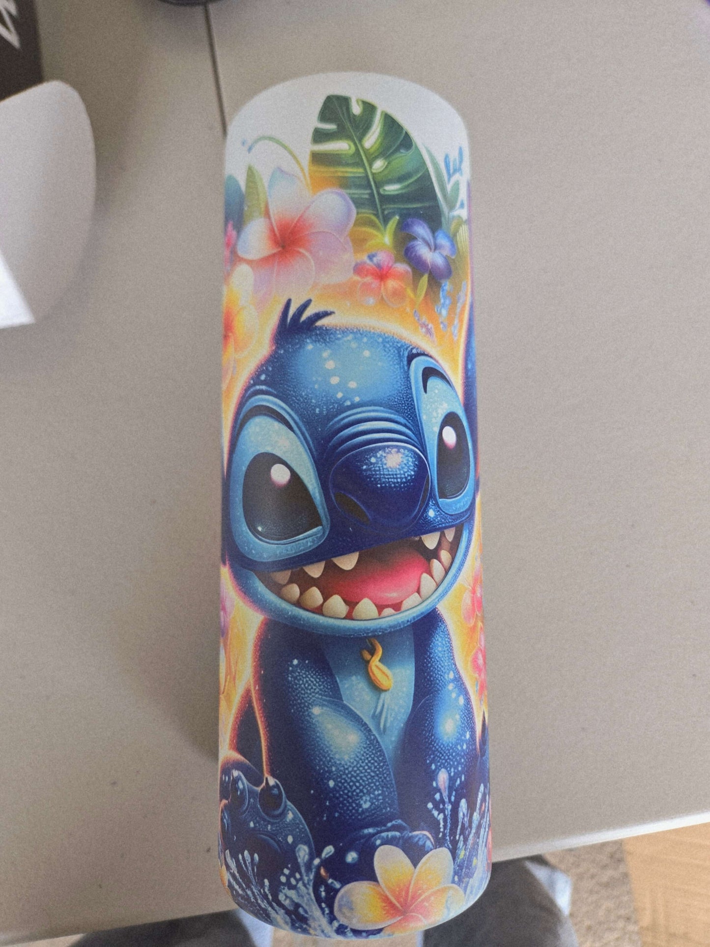 Lilo and Stitch tropical tumbler cup featuring a vibrant blue Stitch with floral designs.