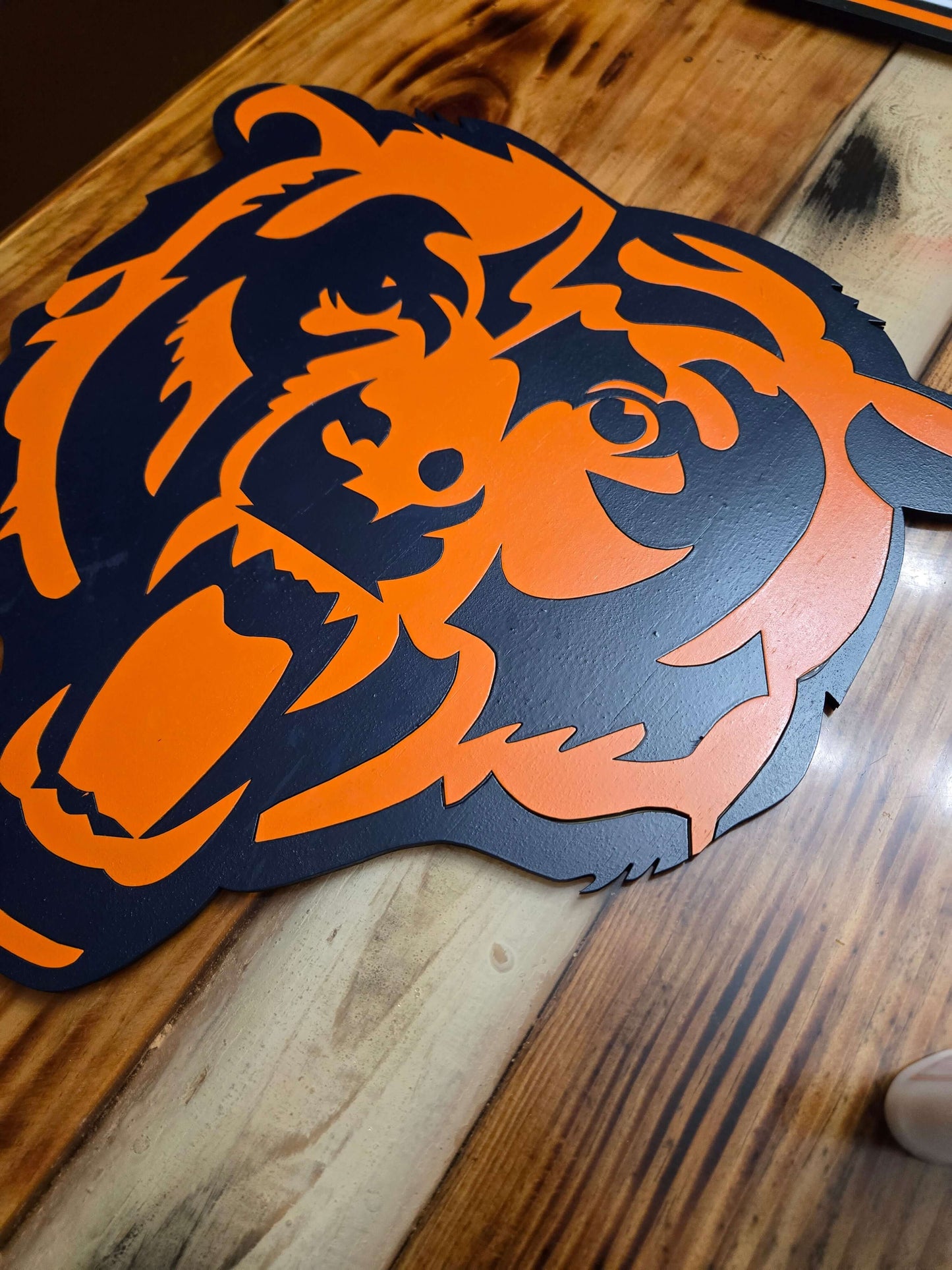 Handcrafted Chicago Bears football logo sign on a wooden table, perfect for sports fans and home decor.