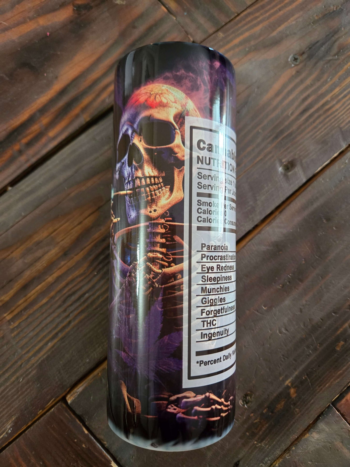 Unique cannabis tumbler cup featuring skull smoking weed design and nutritional info for enthusiasts.
