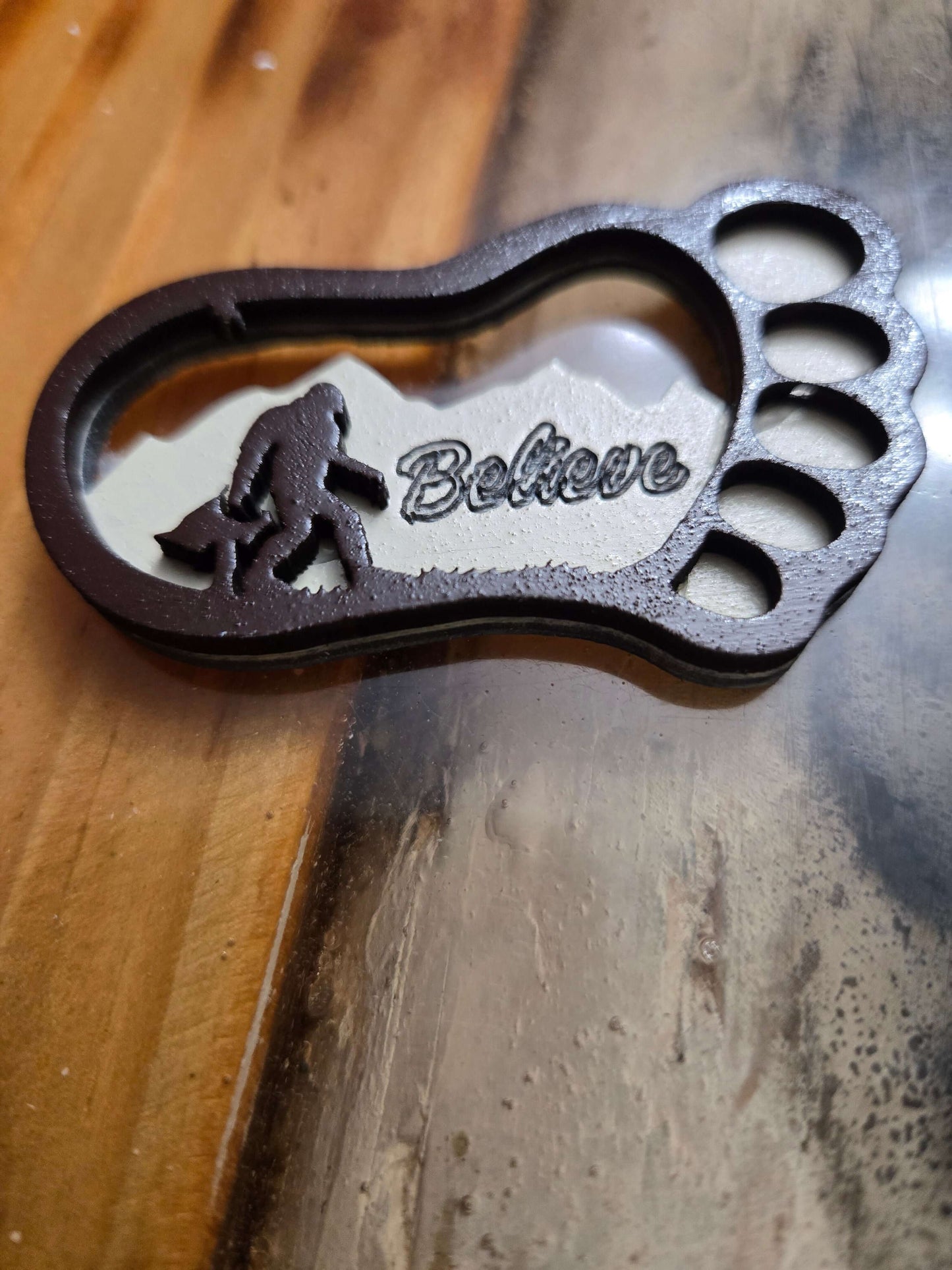 Handmade Bigfoot keychain with 'Believe' inscription, perfect for on-the-go organizing and travel.