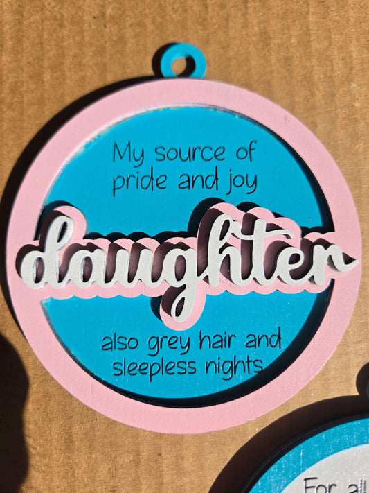 Daughter quoted Christmas ornament featuring heartfelt message about pride and joy.