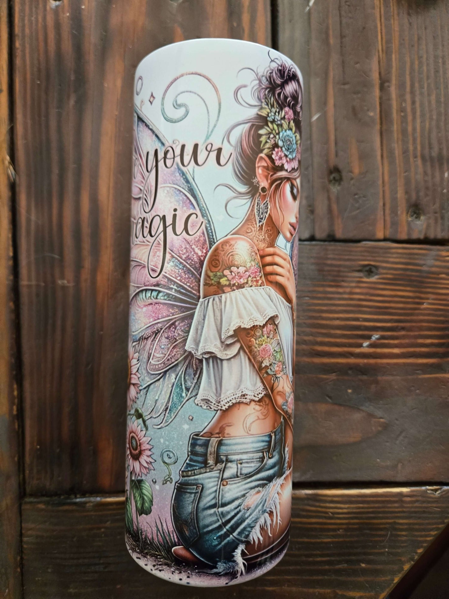 20oz tumbler cup featuring a colorful fairy design with the phrase 'Make your magic', perfect for hot and cold beverages.