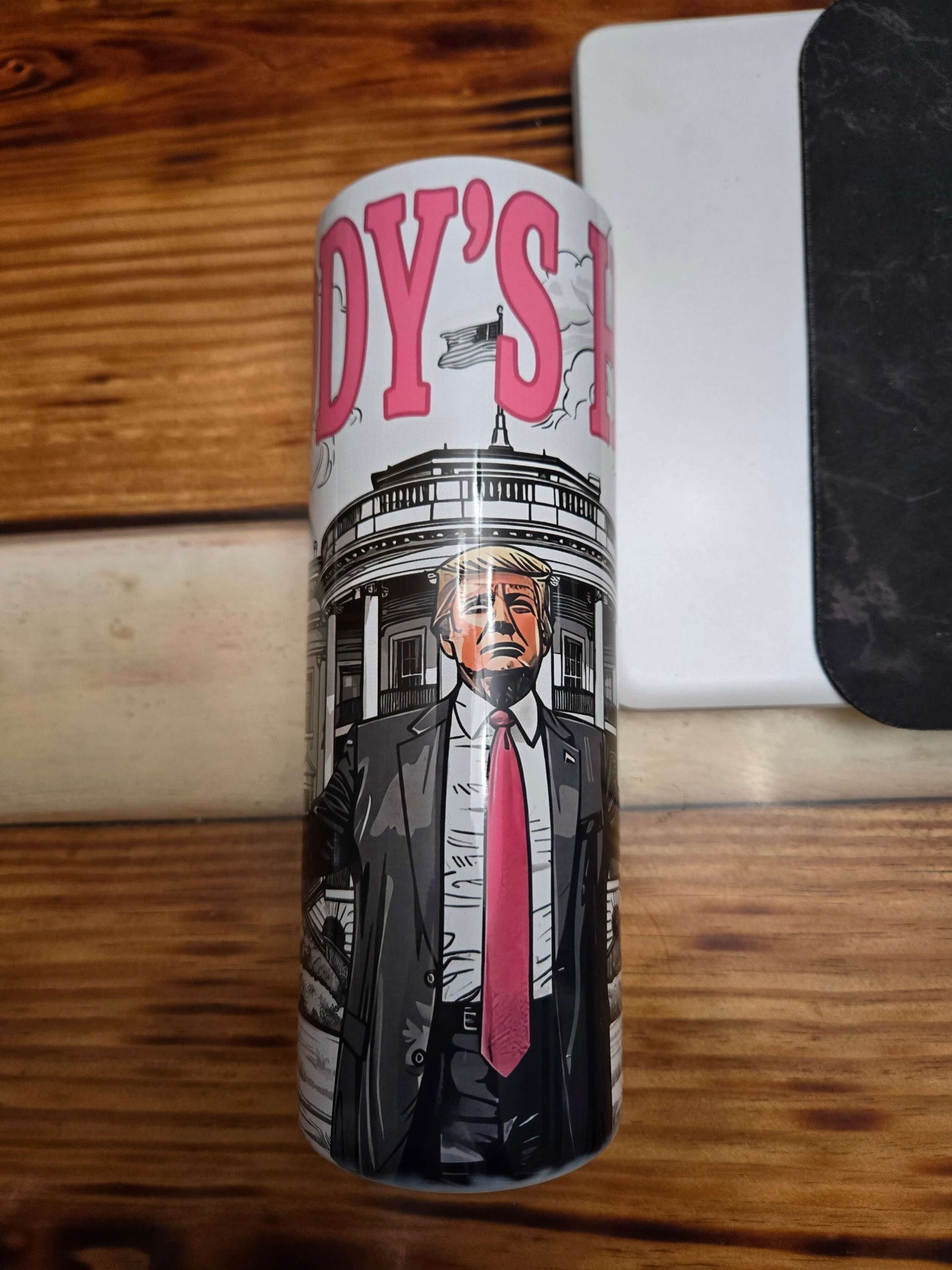 Daddy's Home Trump tumbler cup featuring Trump illustration and iconic White House design.