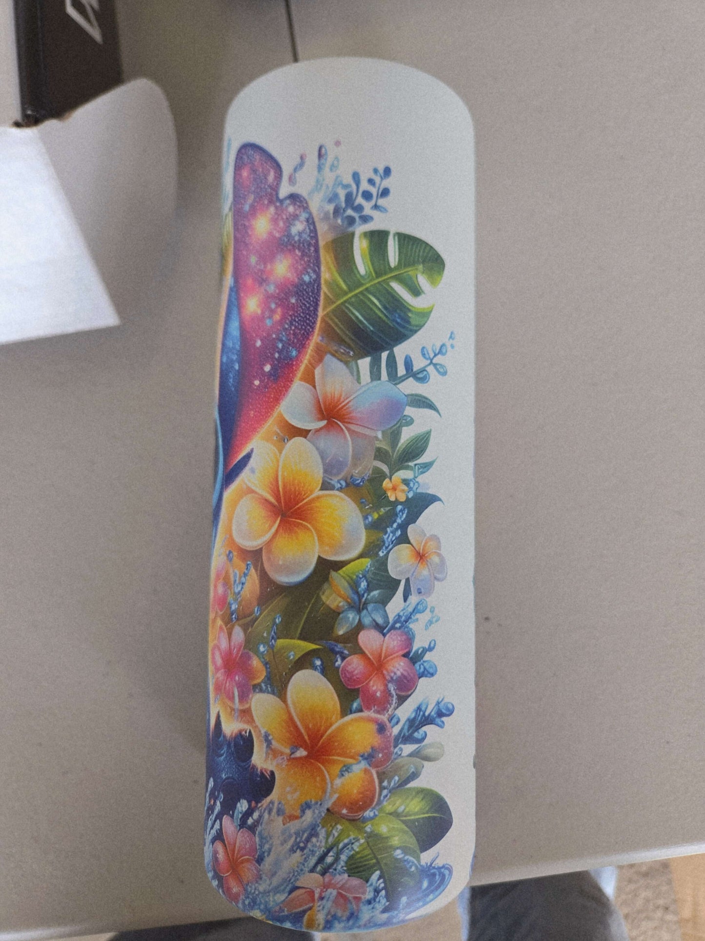 Lilo and Stitch tropical tumbler cup design featuring vibrant flowers and colorful patterns.