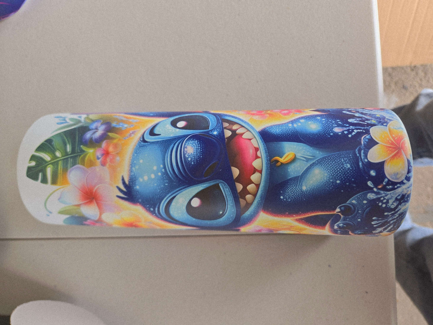 Lilo and Stitch tropical tumbler cup featuring Stitch with vibrant colors and floral designs.