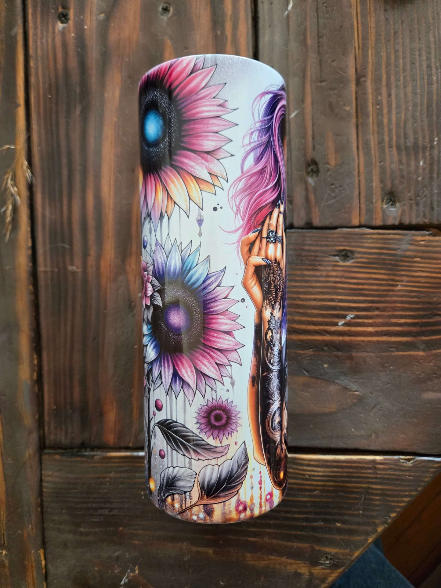Colorful 20oz tumbler featuring floral artwork and stylish design, perfect for travel and everyday use.