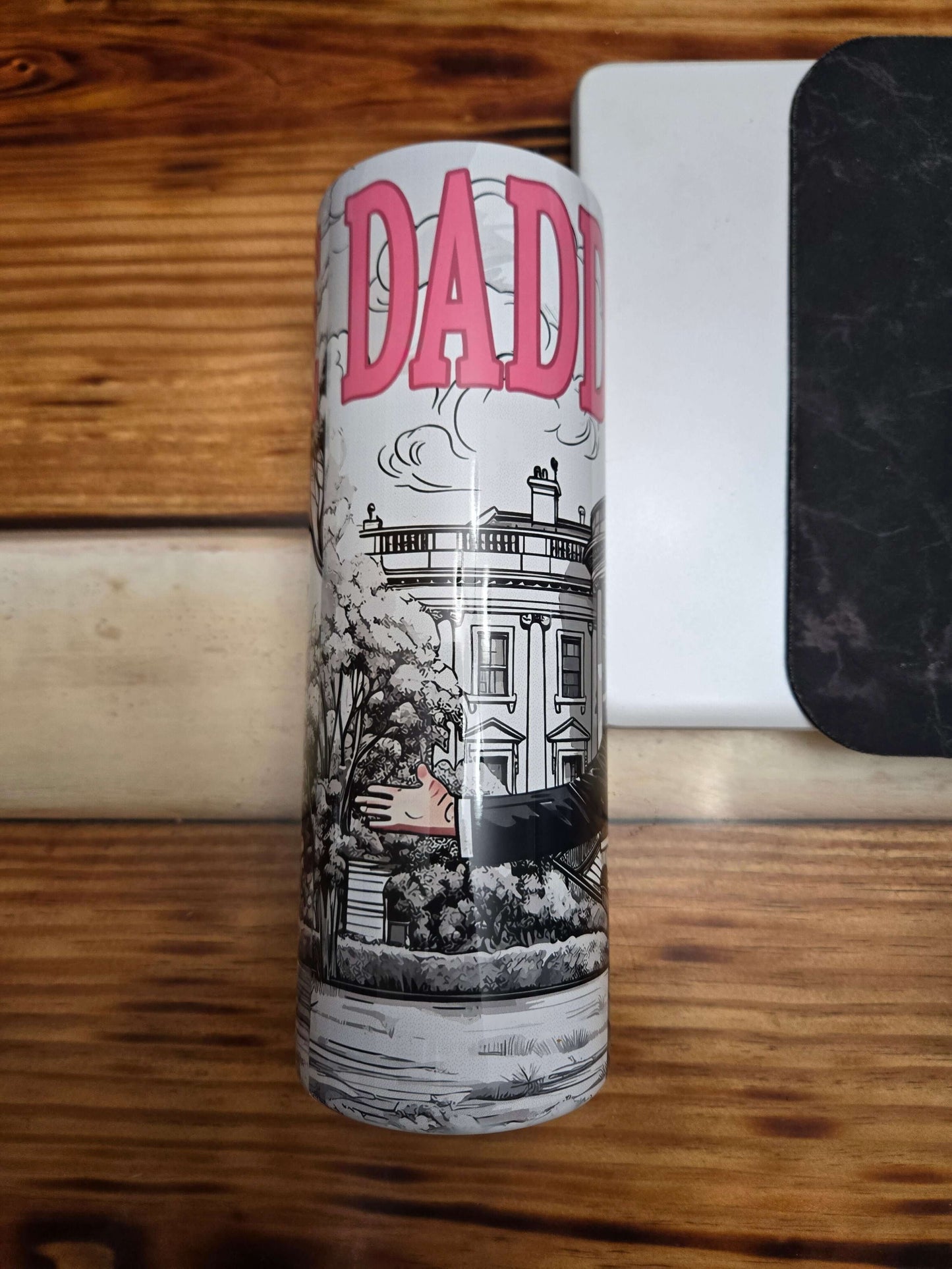 Daddy's Home Trump tumbler cup featuring a cartoon design with a house and playful text.