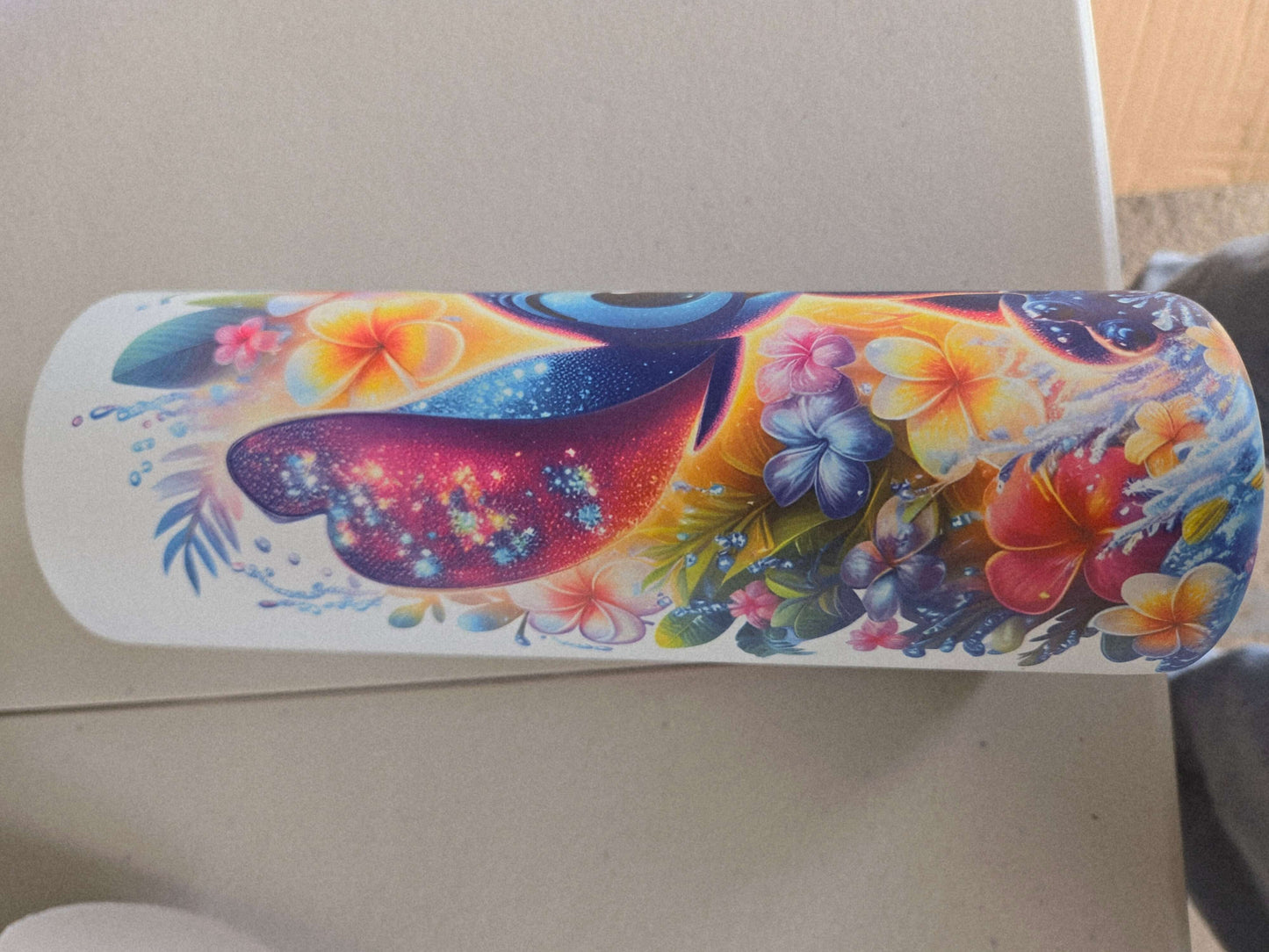 Lilo and Stitch tropical tumbler cup featuring vibrant floral designs and Aloha spirit colors.