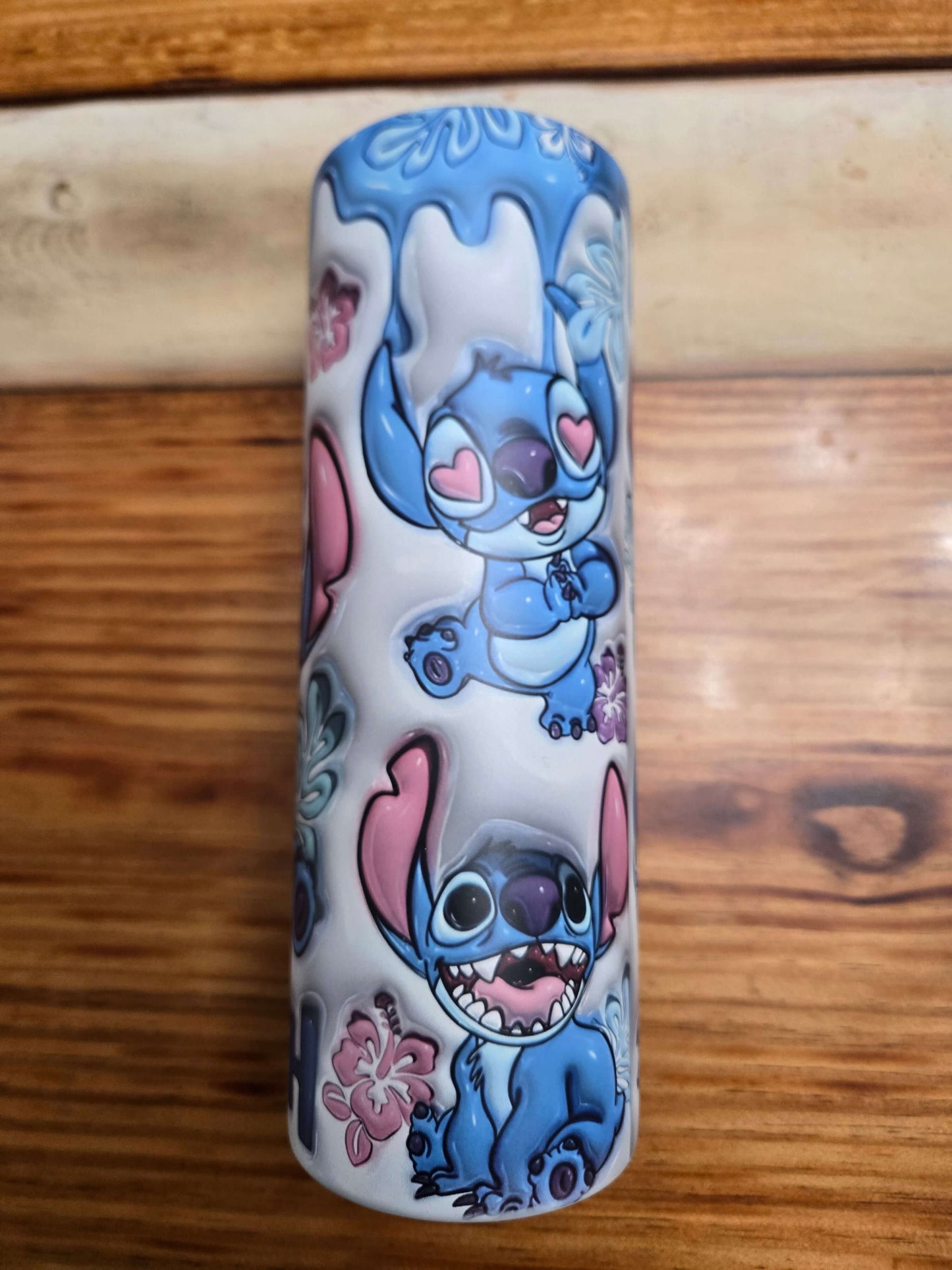 Colorful Lilo and Stitch tumbler showcasing Stitch with playful designs and vibrant colors.