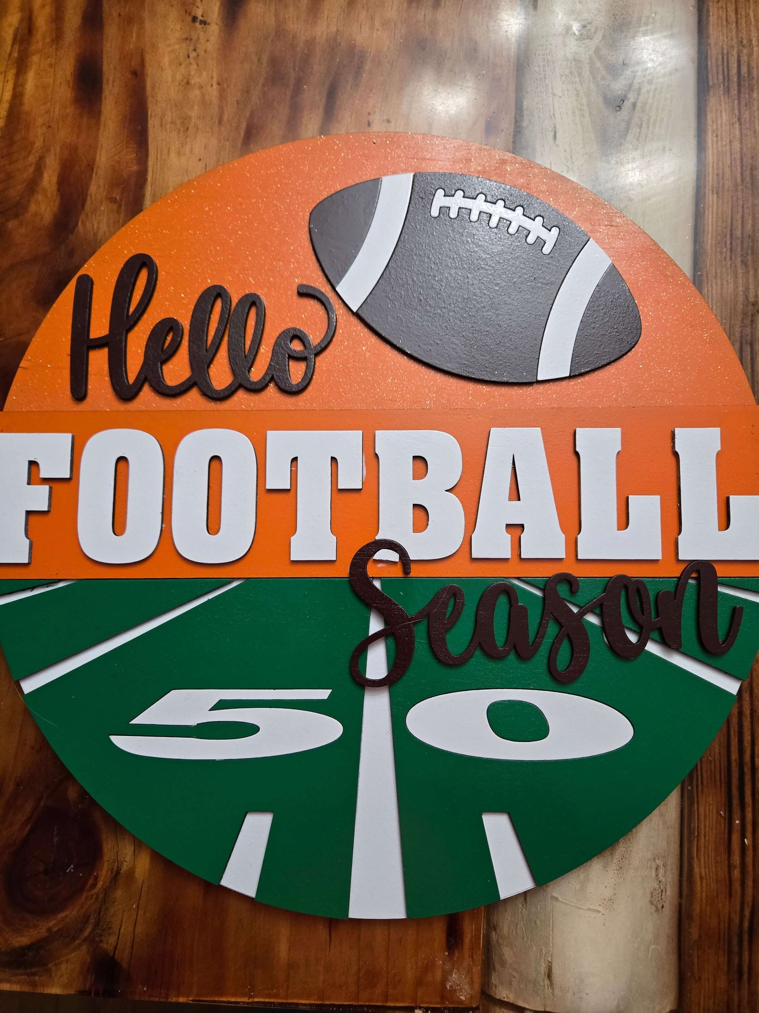 Hello Football Season decorative sign featuring a football and field design, perfect for sports wall decor.