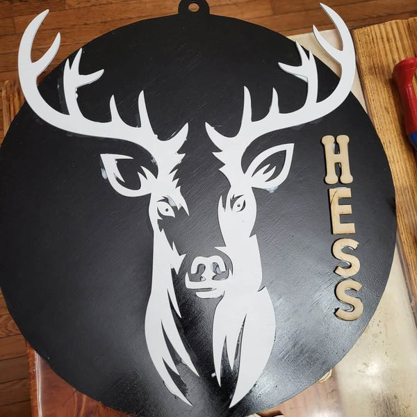 Hess Creations logo featuring a stylized deer head with antlers on a circular black background.