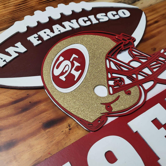 49ers football signs featuring a San Francisco 49ers helmet and team logo, perfect for NFL fans and home decor.
