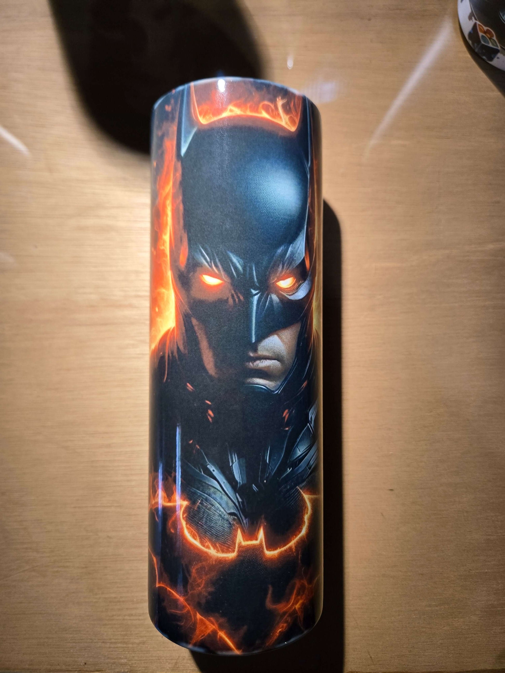 Batman 20oz tumbler cup featuring bold superhero design with glowing eyes and iconic bat symbol.