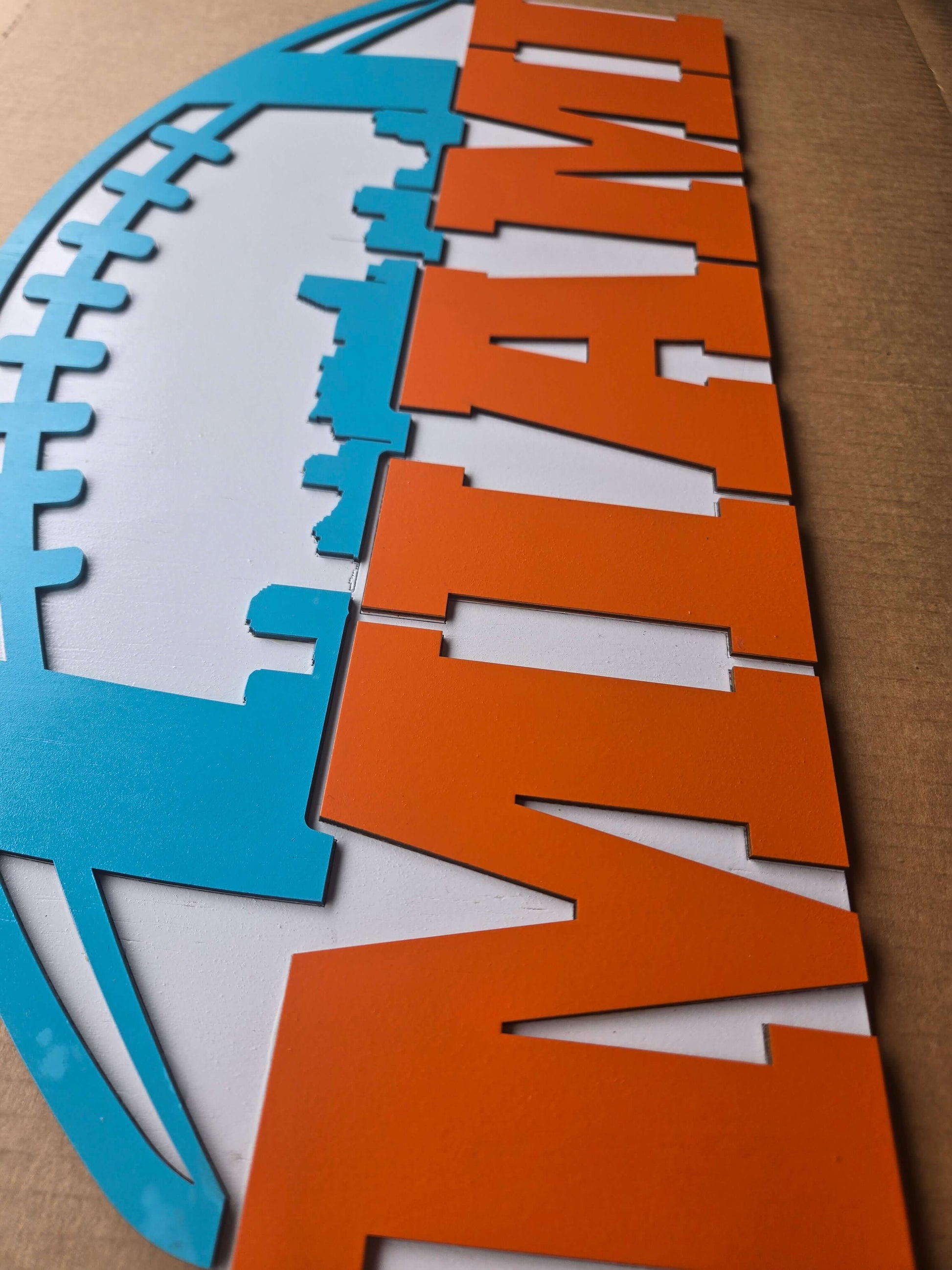 Miami football wooden decor sign showcasing vibrant colors and a sporty design for home decor.