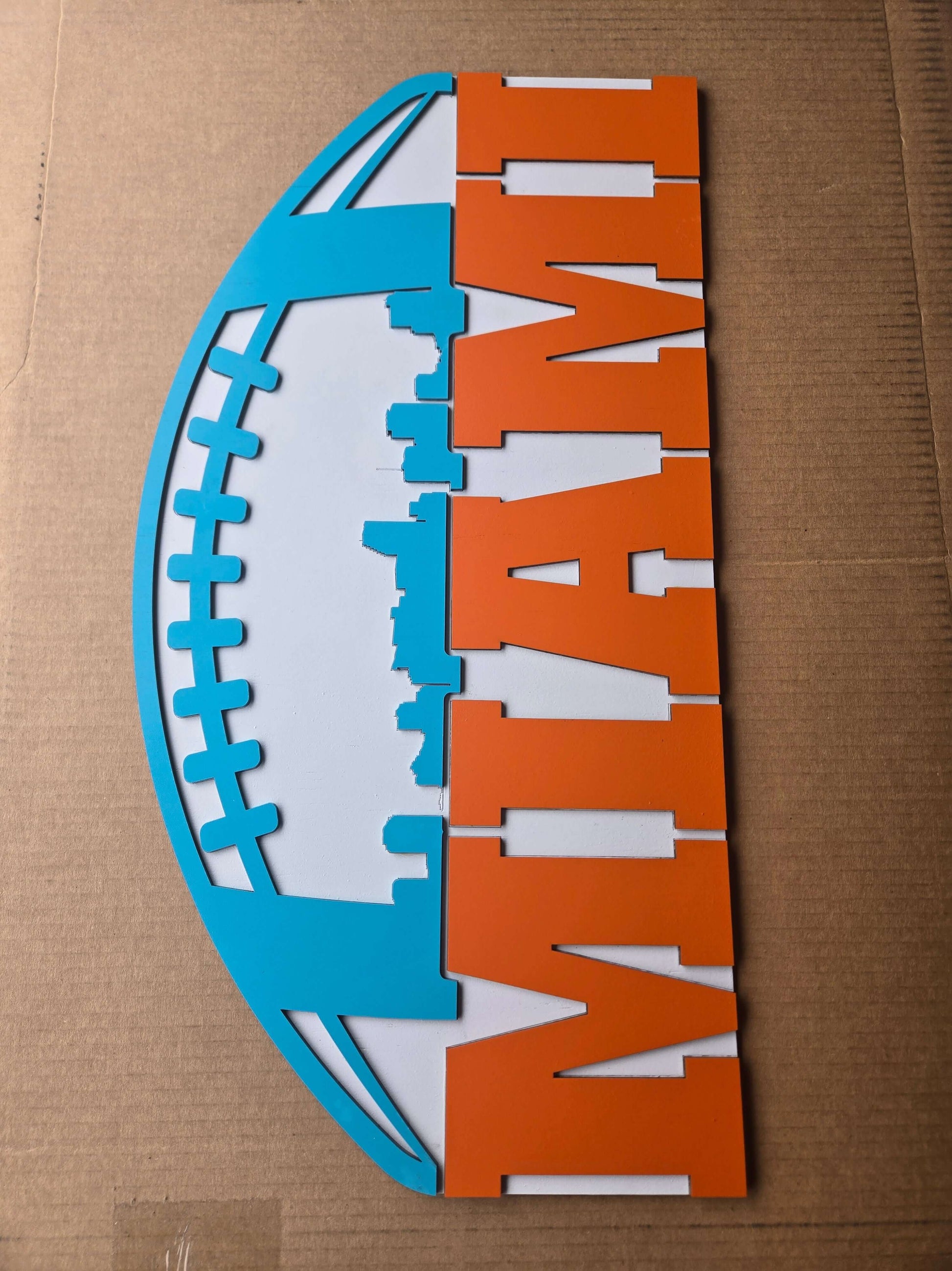 Miami football wooden decor sign showcasing the Miami skyline and vibrant team colors.