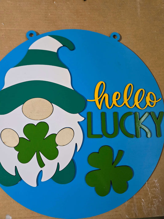 Hello lucky St. Patrick's Day gnome wooden sign with shamrock decorations.