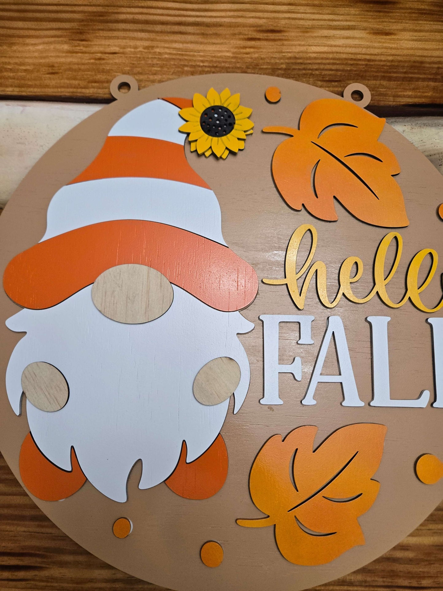 Hello Fall gnome decor sign featuring autumn leaves and a sunflower, perfect for seasonal home decoration.