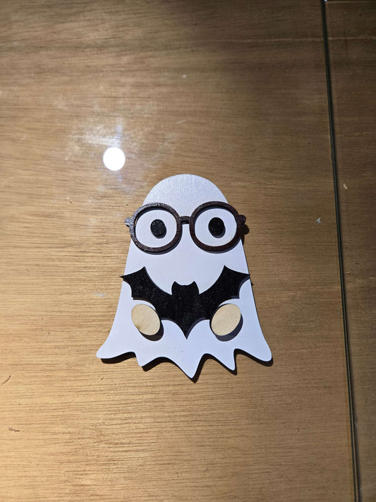 Small ghost magnet with glasses and bat design, perfect for holiday decor featuring small gnomes.
