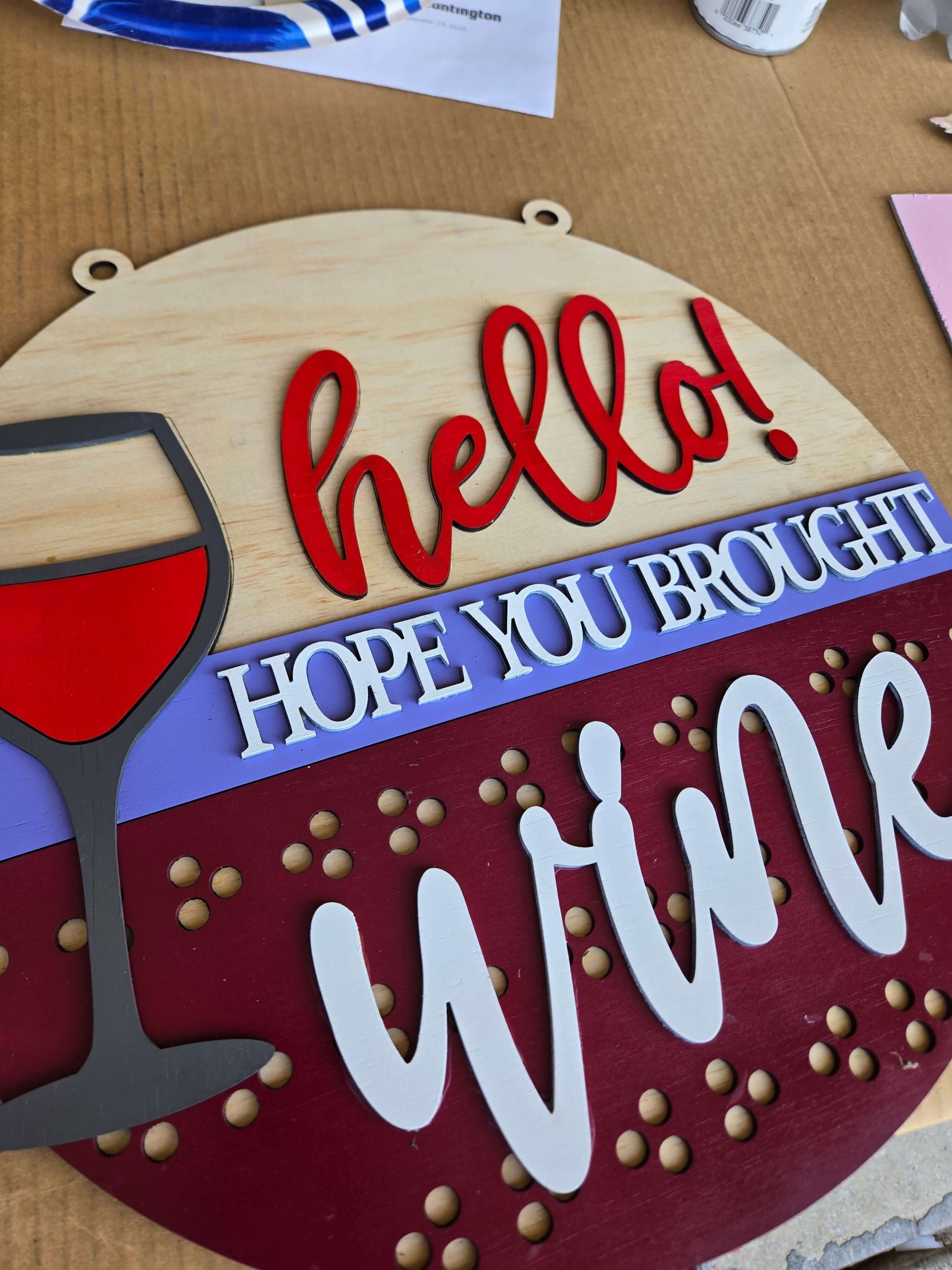 Hope You Brought Wine wooden sign with a wine glass, adding rustic charm to home decor.