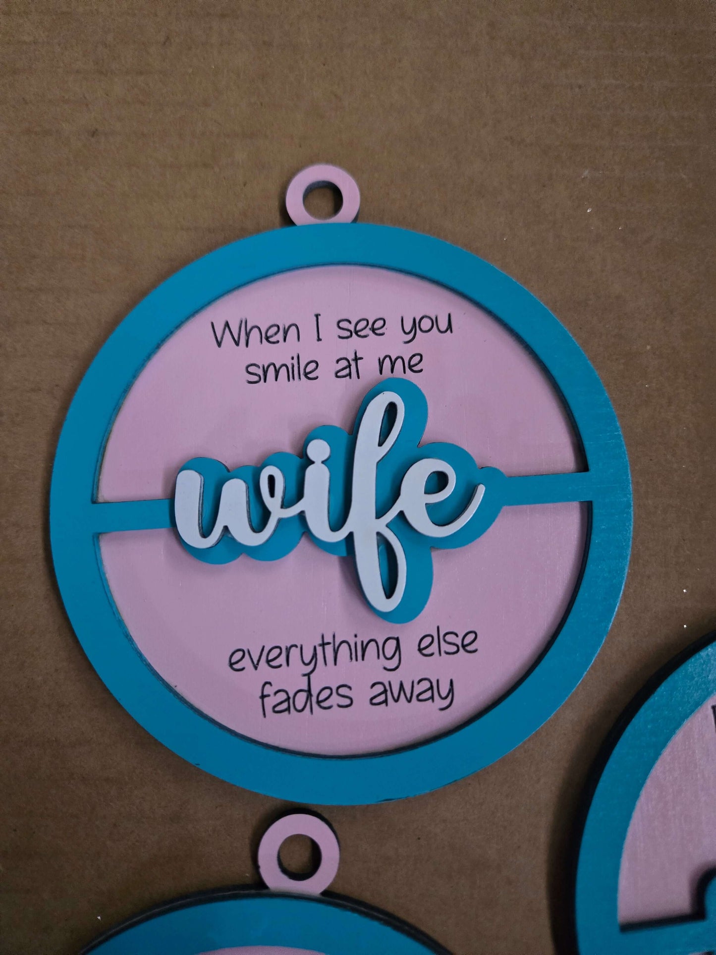 Wooden Christmas ornament with the word 'wife' and a heartfelt quote, celebrating love and devotion.