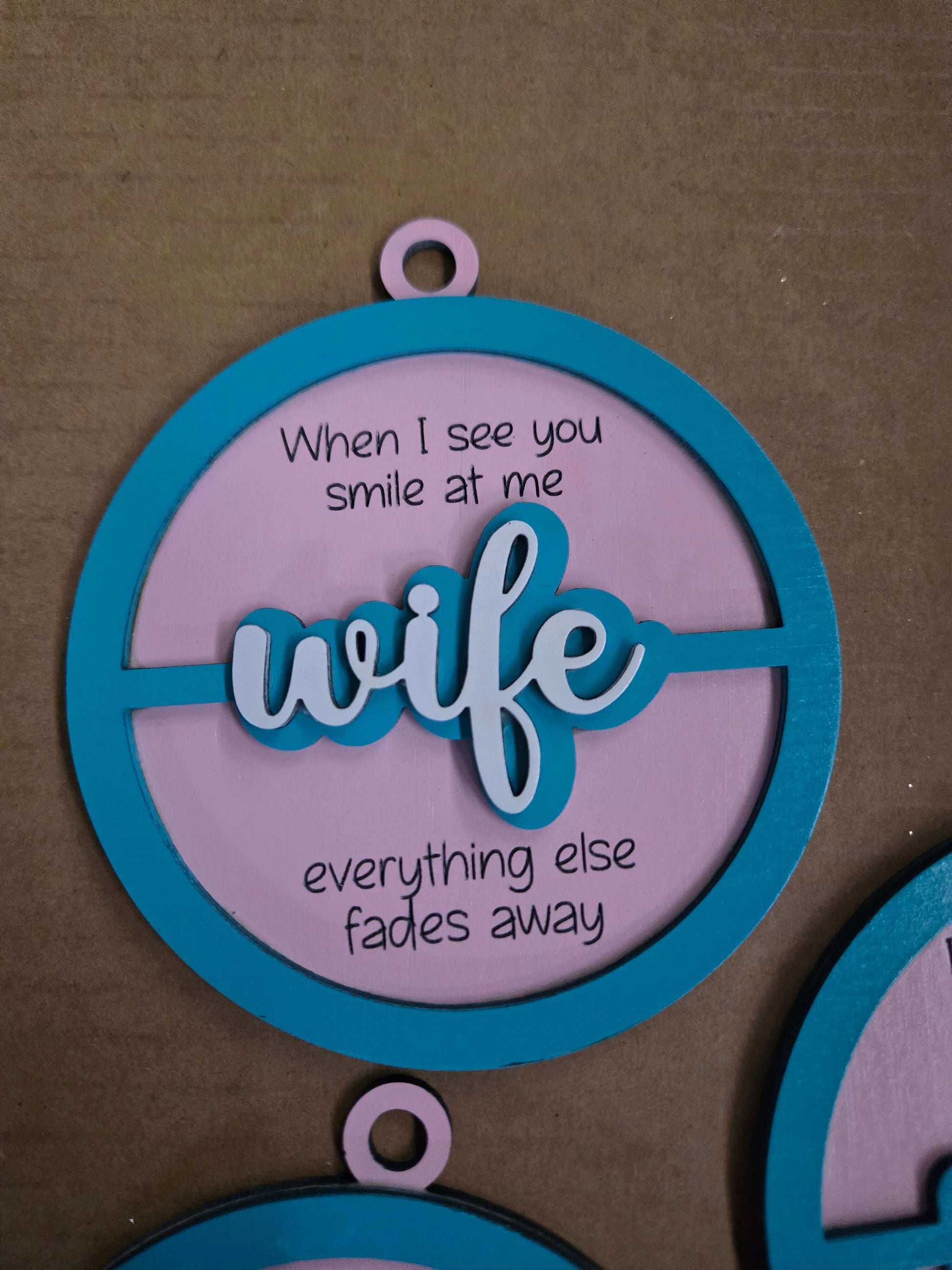 Wooden Christmas ornament with the word 'wife' and a heartfelt quote, celebrating love and devotion.