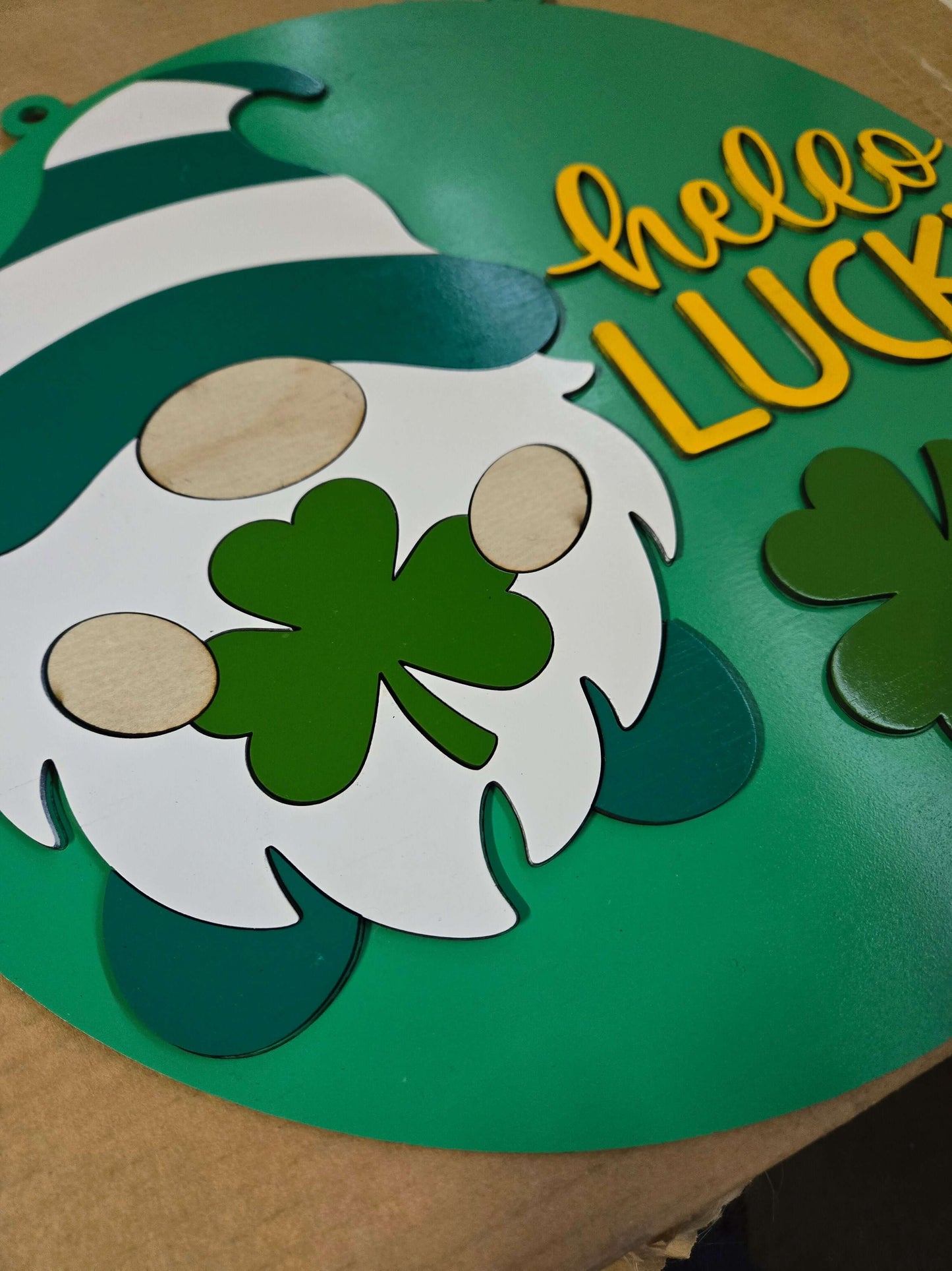 Hello lucky St. Patrick's Day gnome wooden sign featuring a green shamrock and cheerful design.
