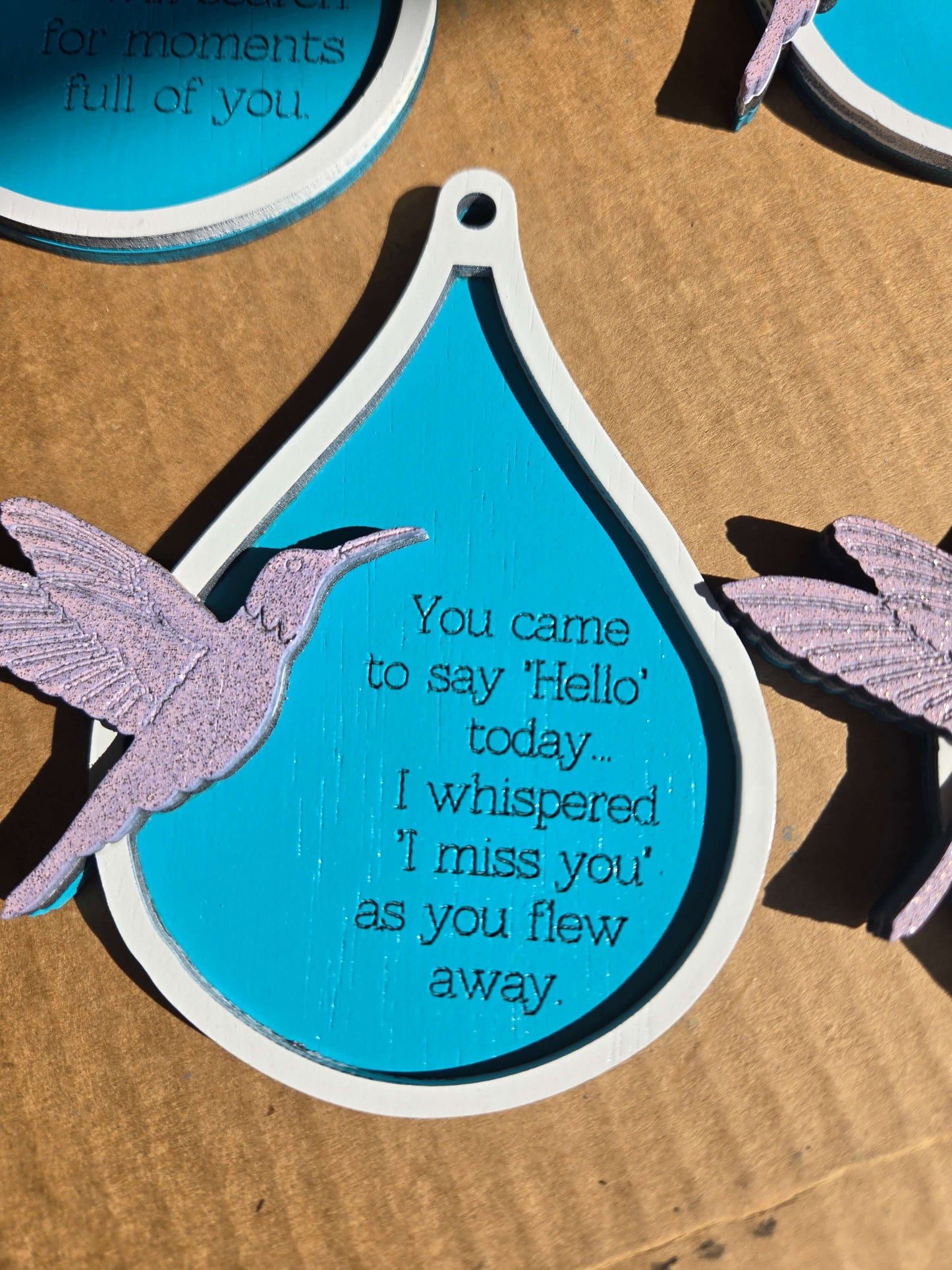 Humming bird xmas ornaments with quotes, vibrant holiday decor for joyful moments and remembrance.