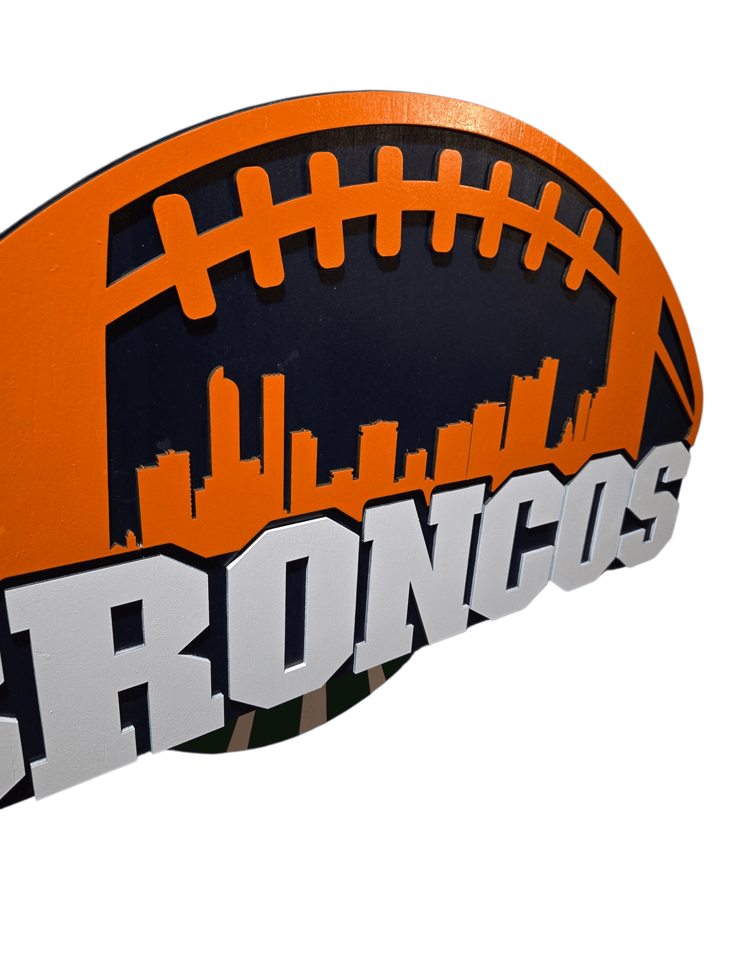 Broncos wooden football decor sign featuring vibrant team colors and a city skyline design.