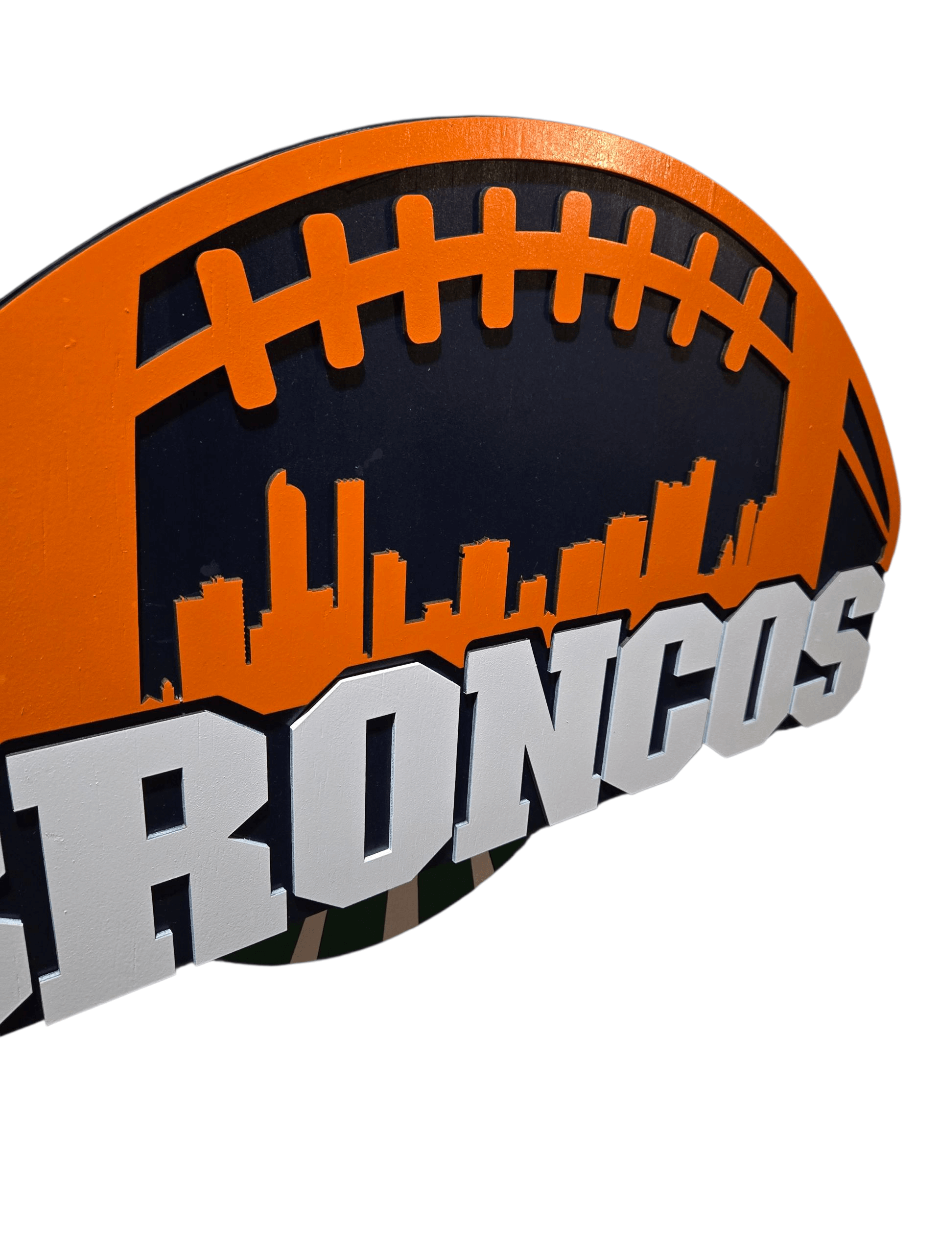 Broncos wooden football decor sign featuring vibrant team colors and a city skyline design.