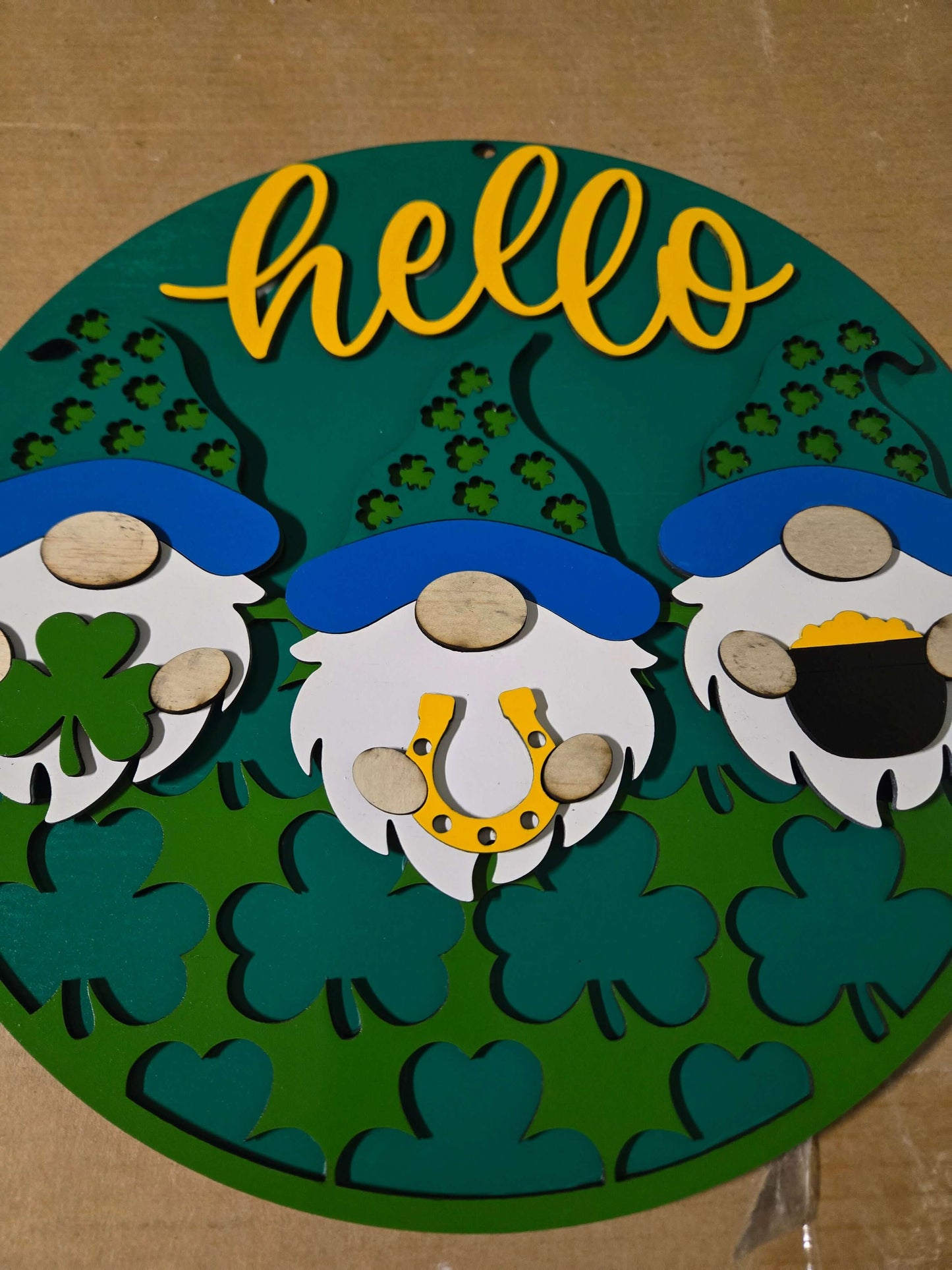 Hello St. Patrick's Day wooden decor sign featuring gnomes and shamrocks, perfect for festive home decoration.