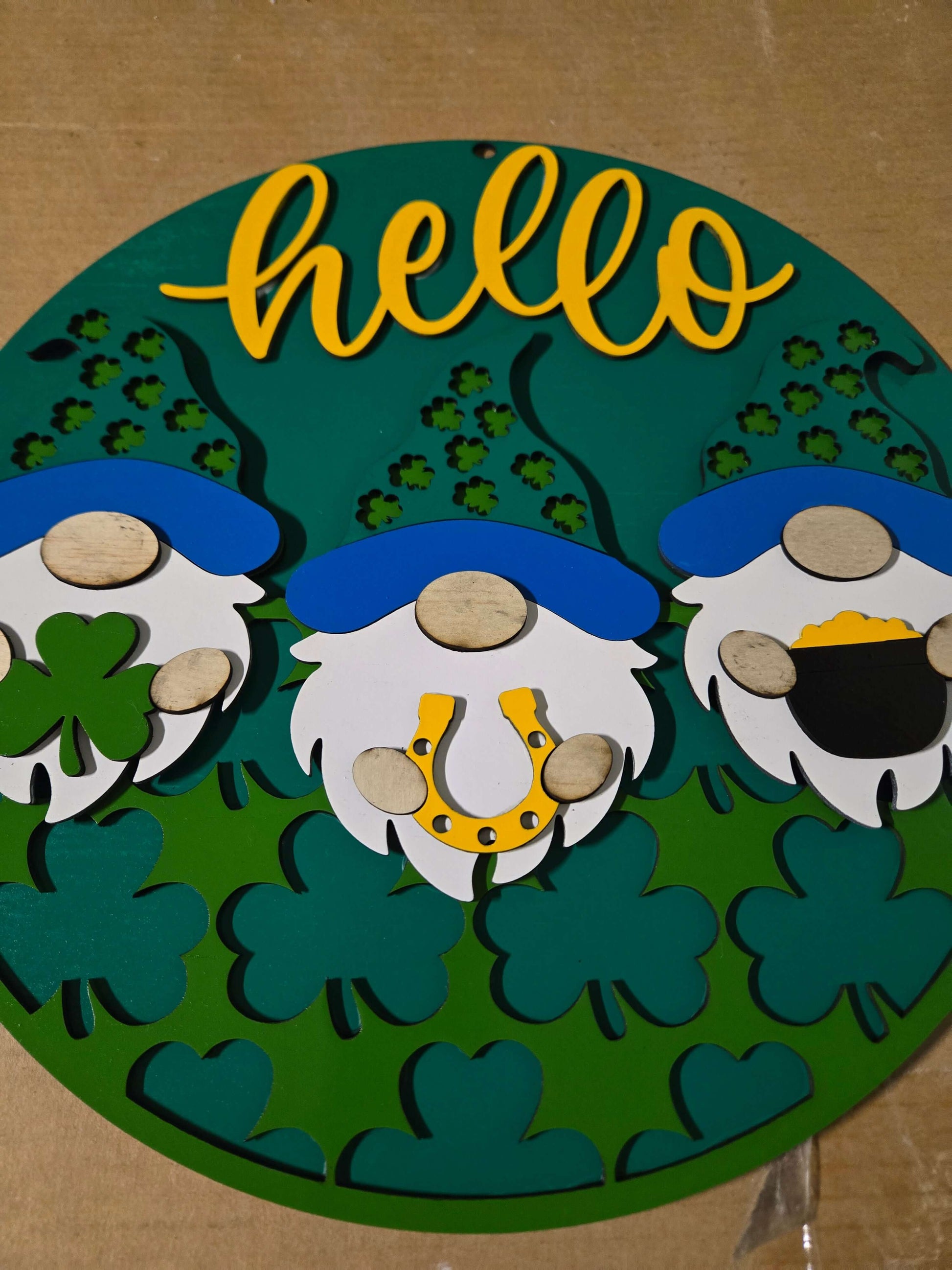 Hello St. Patrick's Day wooden decor sign featuring gnomes and shamrocks, perfect for festive home decoration.
