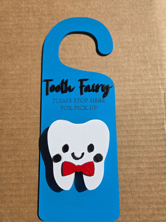 Tooth fairy door knob hanger with a smiling tooth design, perfect for kids' bedtime routines.