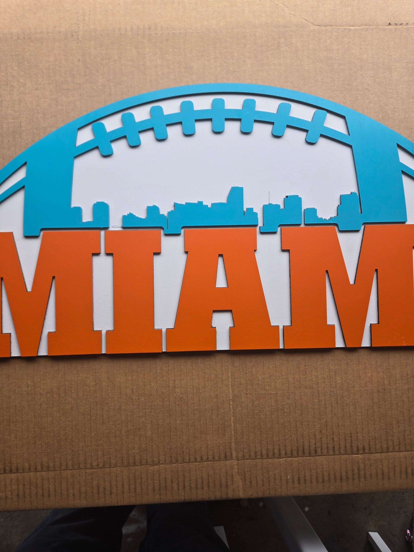 Miami football wooden decor sign featuring vibrant colors and city skyline design.