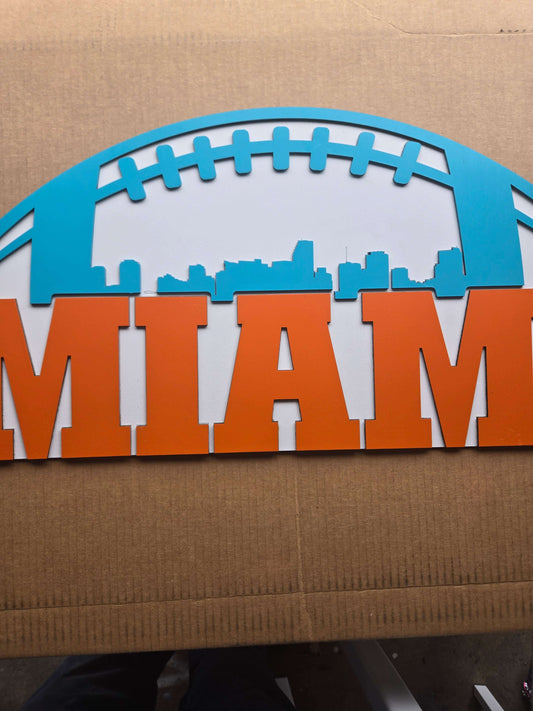 Miami football wooden decor sign featuring vibrant colors and city skyline design.