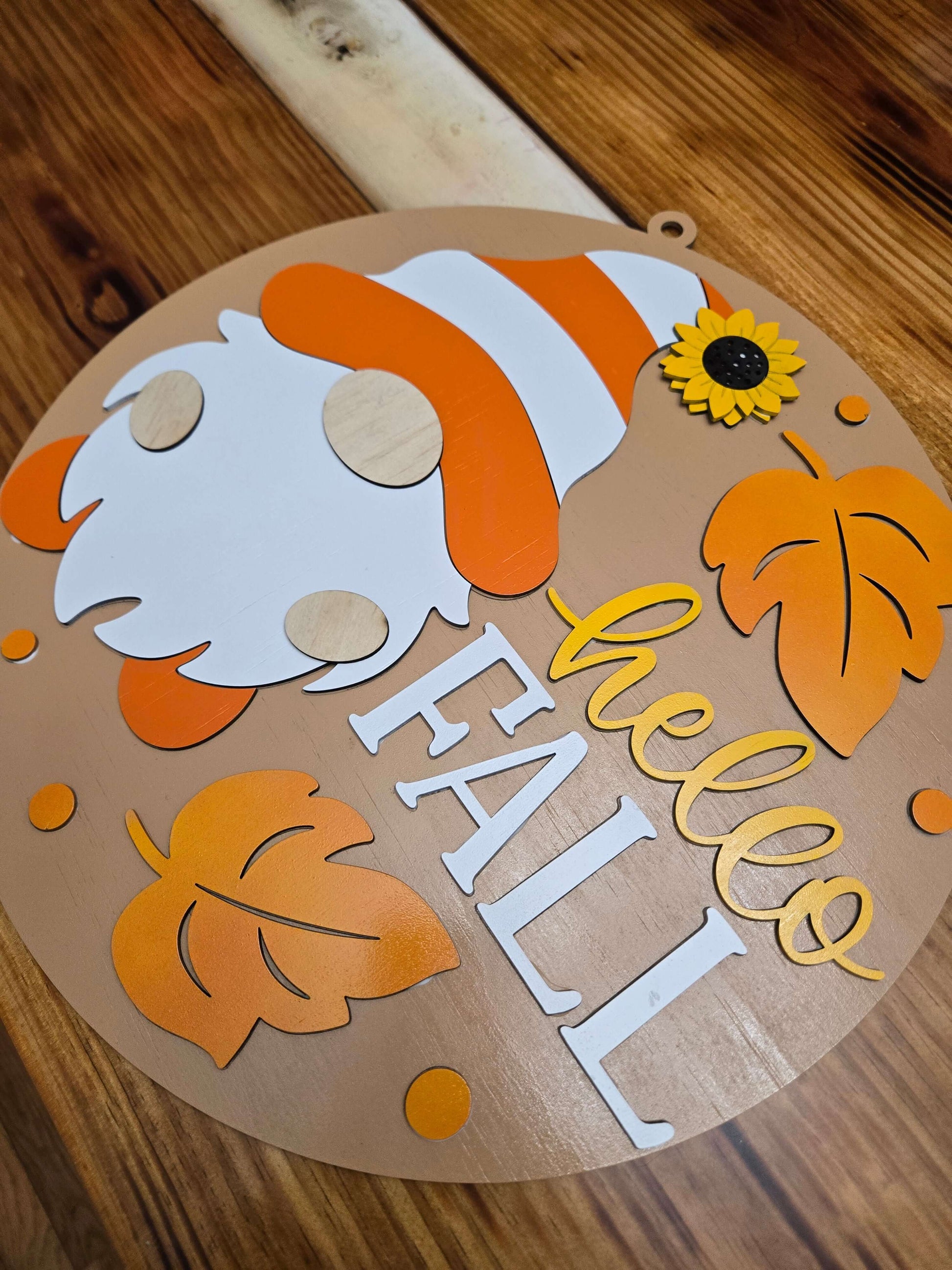 Hello Fall gnome wooden decor sign featuring autumn leaves and a sunflower, perfect for seasonal home decoration.