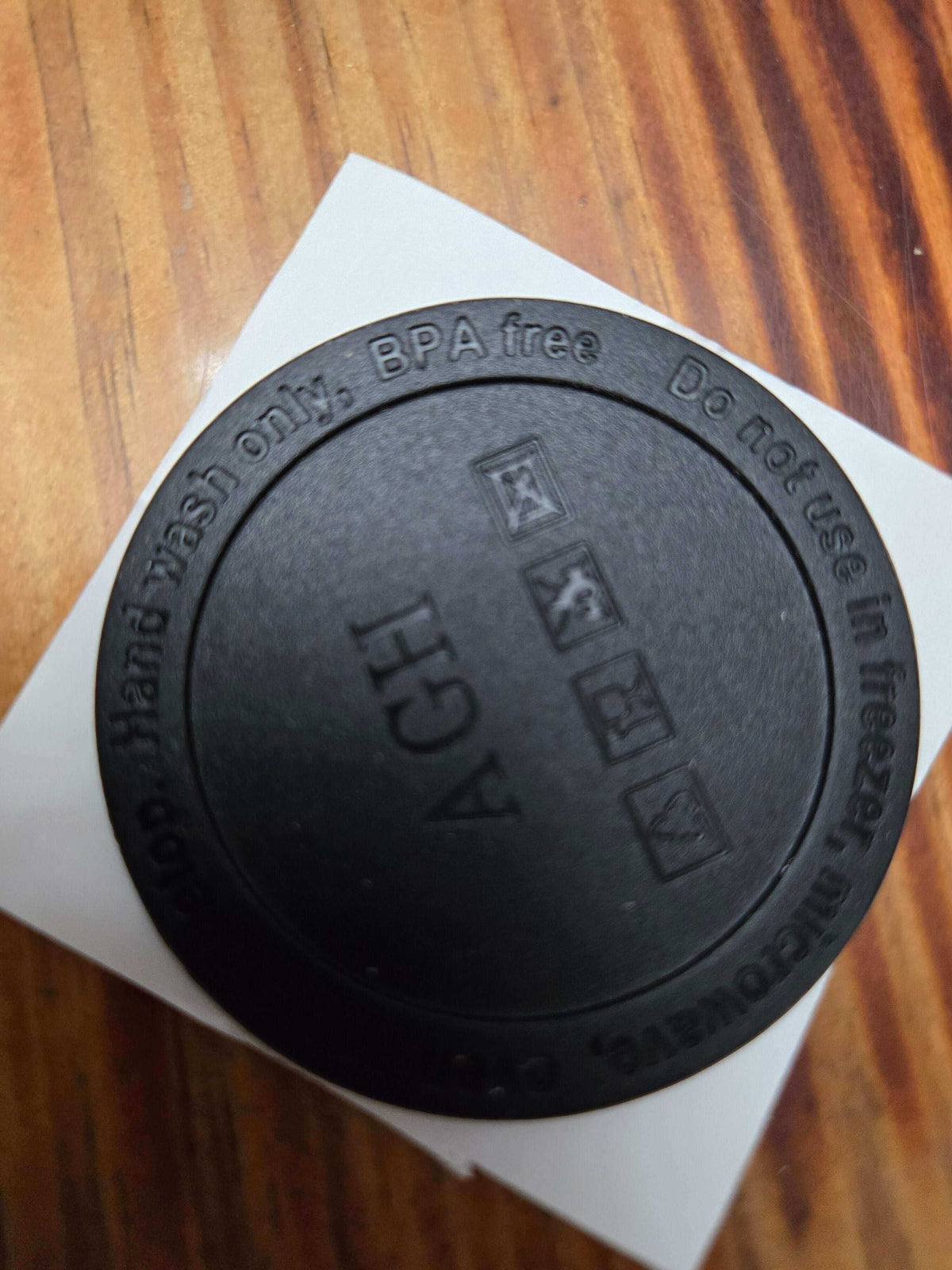 5 o clock somewhere product lid, BPA free, hand wash only, black lid on wooden table