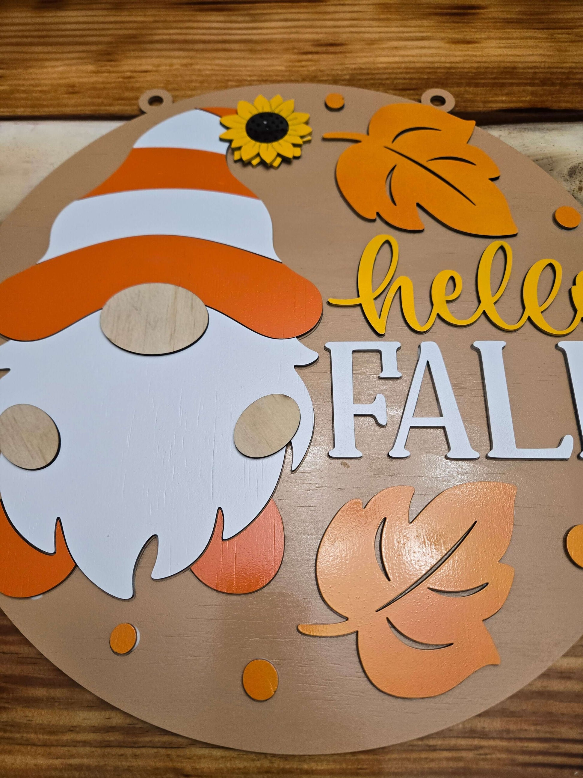 Hello Fall wooden gnome decor sign with autumn leaves and a sunflower, perfect for seasonal home decoration.