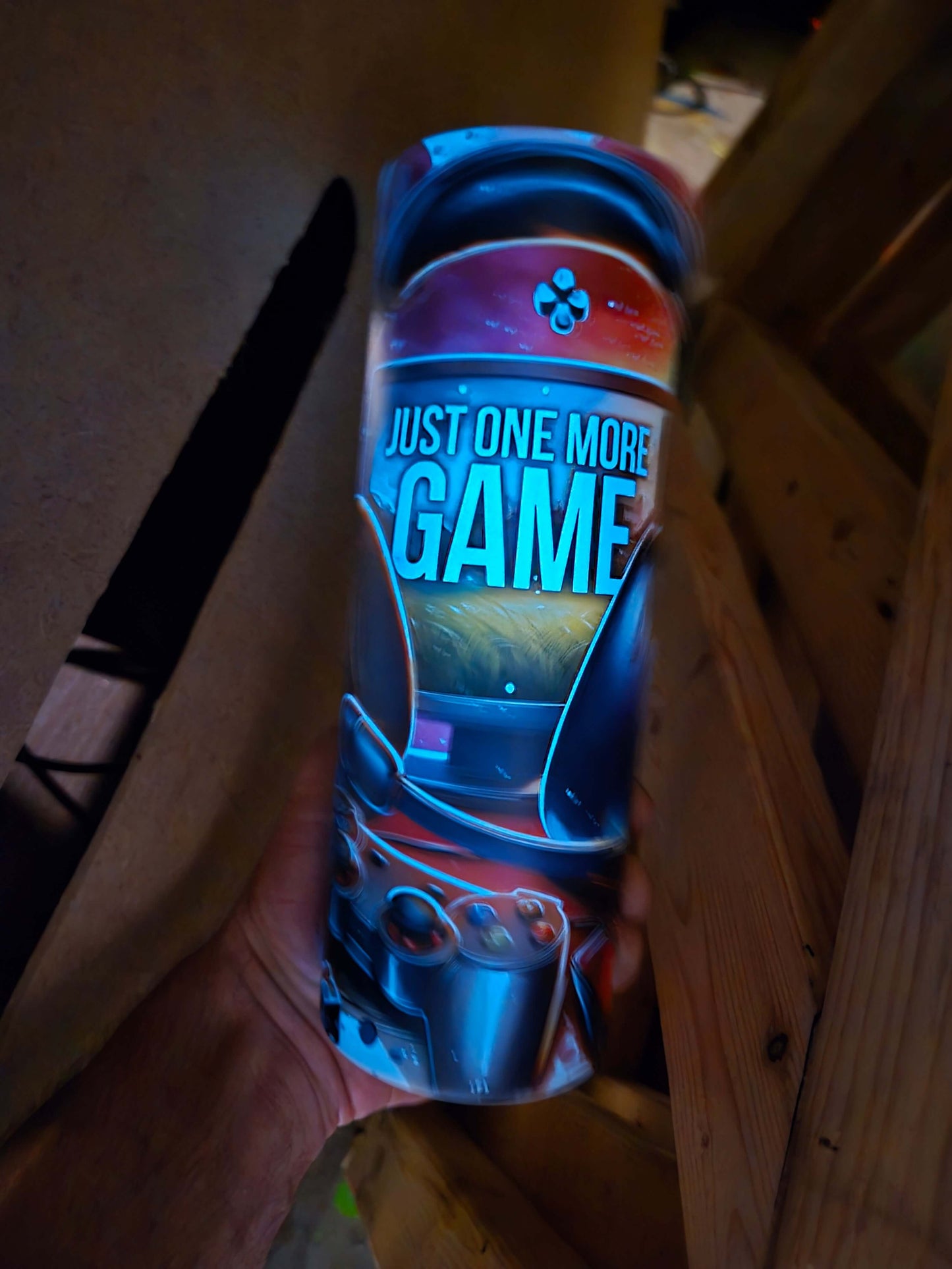 Gamer style custom 20oz tumbler cup with 'Just One More Game' design for hydration during gaming.