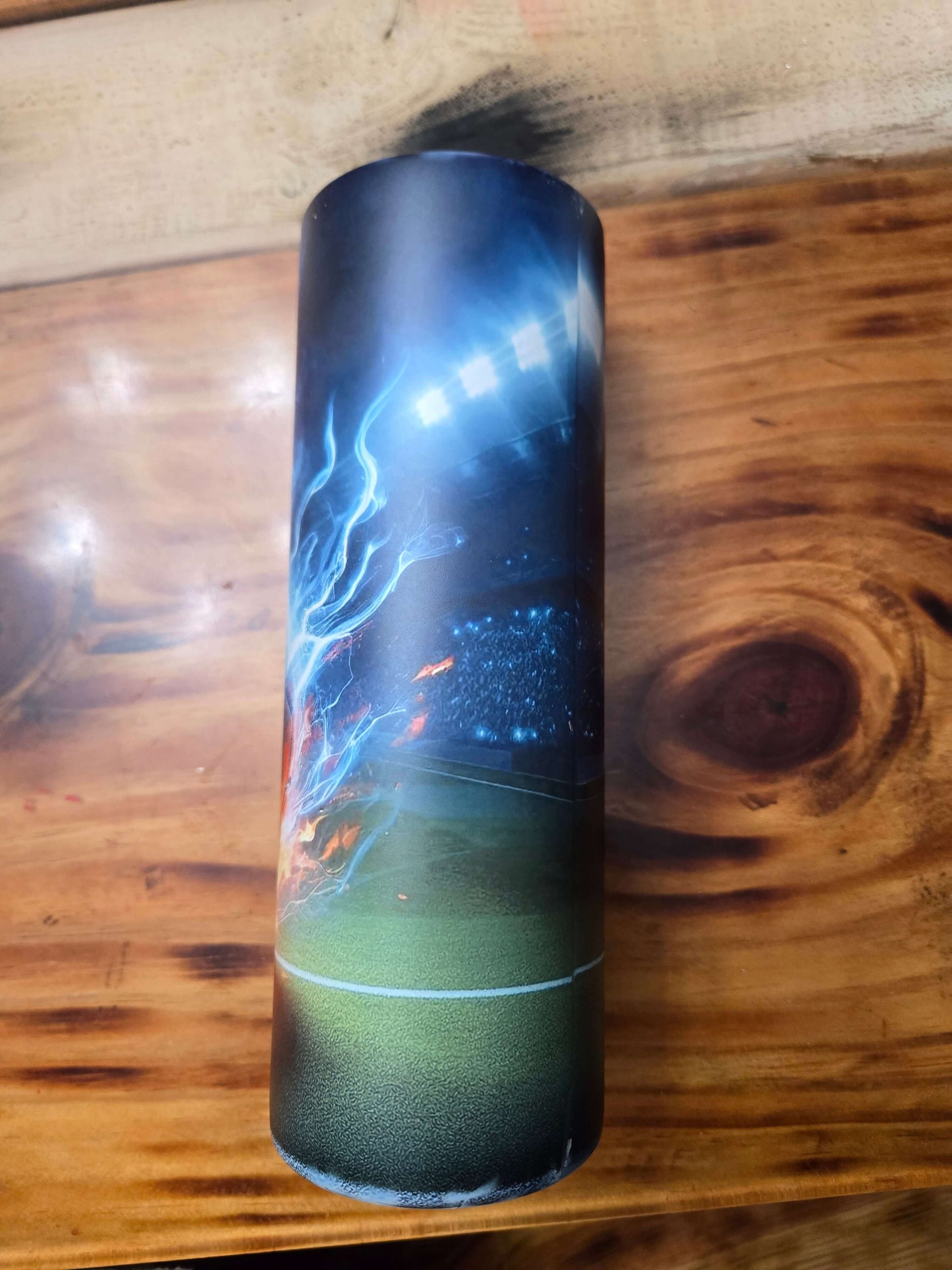 Soccer tumbler cup featuring a vibrant stadium scene with lights and dynamic effects.